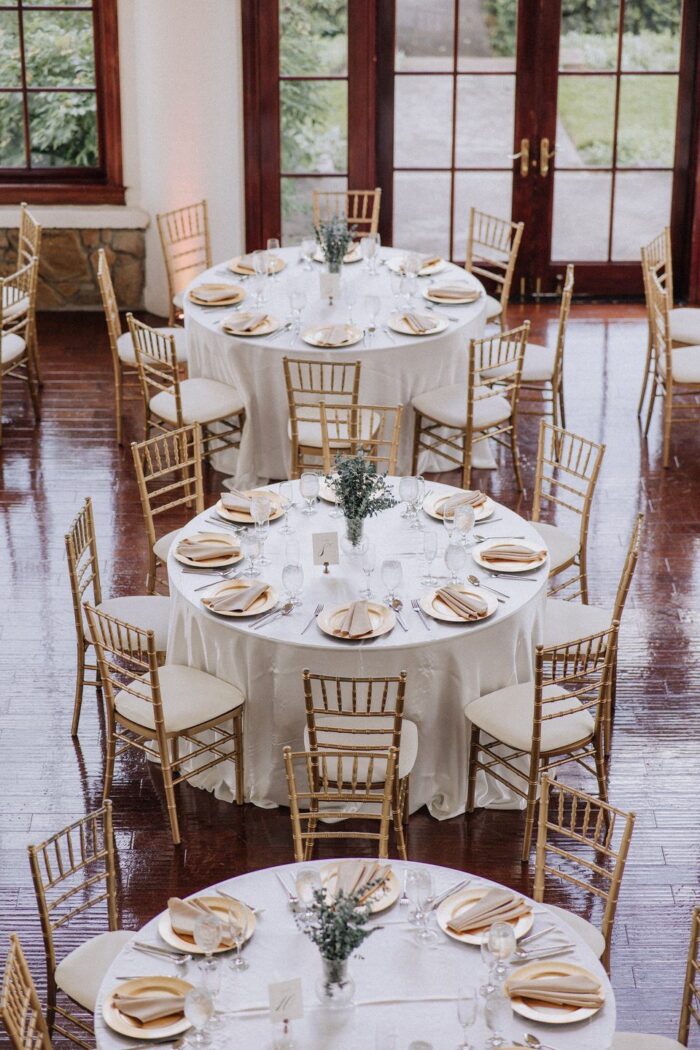 Elegant reception styling with soft greenery and warm ambient lighting